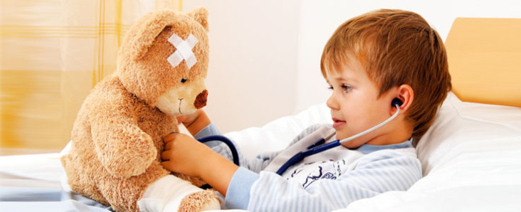 Kid-checking-his-teddy-bear-as-patient